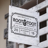 Root & Toot logo - Similar company to Levy Mccallum
