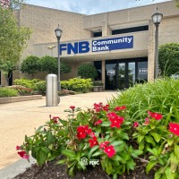 FNB Community Bank logo - Similar company to Elevated Tee Box