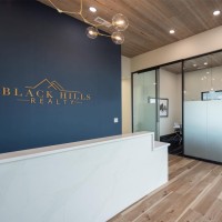 BLACK HILLS SD REALTY logo - Similar company to Visit Watertown
