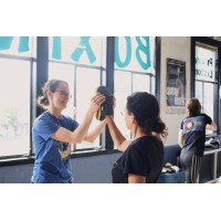 Empowered Movement Self-Defense logo - Similar company to Thrive Empowerment Center