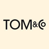 TOM&Co logo - Similar company to Russen & Turner