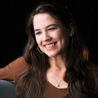 Liz Moughon DP logo - Similar company to The Chris Voss Show Podcast