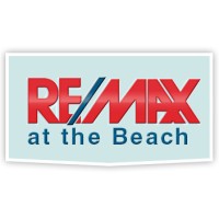 RE/MAX at the Beach logo - Similar company to Spot Real Estate