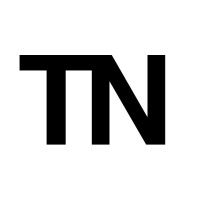 TaxNomadism logo - Similar company to Freedom Files