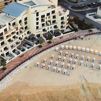 The Townhouses The Pearl Qatar logo - Similar company to Roomy Qatar
