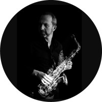 Fred Mister Sax logo - Similar company to Next Vision