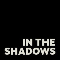 In the shadows | Postproducción logo - Similar company to Comppo Compañía De Post
