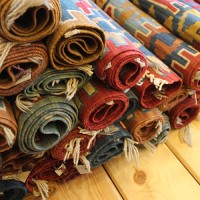 nHandmadeRug logo - Similar company to Qadimi Rugs