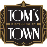 Tom's Town Distilling Co. logo - Similar company to American Bottling