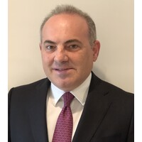 Kyriakos Kofinas ActionCOACH logo - Similar company to Coach Ubaid