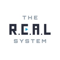 The R.E.A.L System logo - Similar company to Outreach Magic