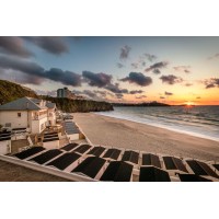 Colonial on Tolcarne Beach logo - Similar company to Cornwall Holiday Home Management