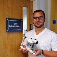 CW Dentures logo - Similar company to Inclusive Bytes C.I.C.