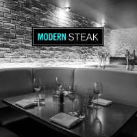 Modern Steak logo - Similar company to Lester Communications Inc.