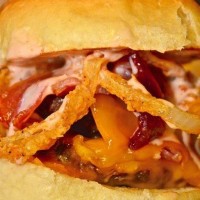 Wood and Iron Game Day Restaurant logo - Similar company to Tazza Kitchen