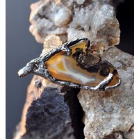 Energyos handmade jewelry with raw crystals and freeform gems. Made in Morden, Manitoba, Canada. logo - Similar company to Appraisal Institute Of Canada - Manitoba