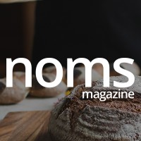 Noms Magazine logo - Similar company to Craft & Being Studio | Marketing And Design For Mission-Led Organizations
