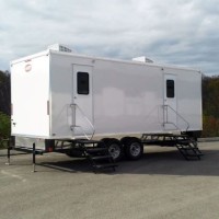The Lavatory Restroom, Shower, and Laundry Trailers logo - Similar company to Creative Laundry Systems